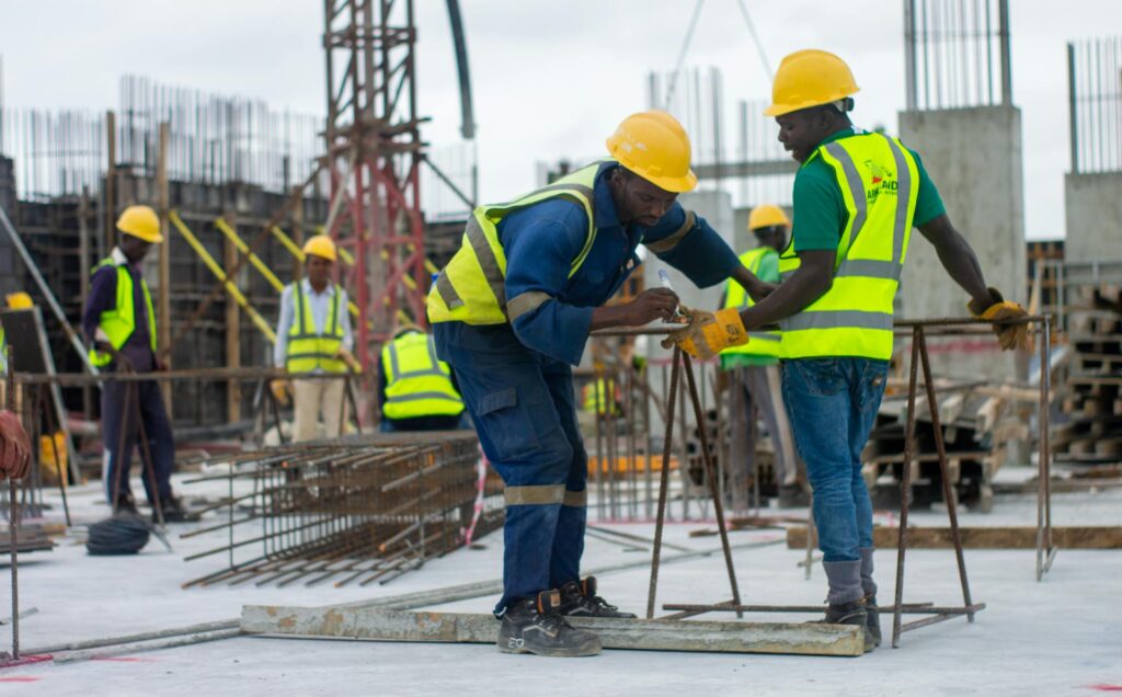 Thai construction workers on a building site illustrating the migrant worker permit system