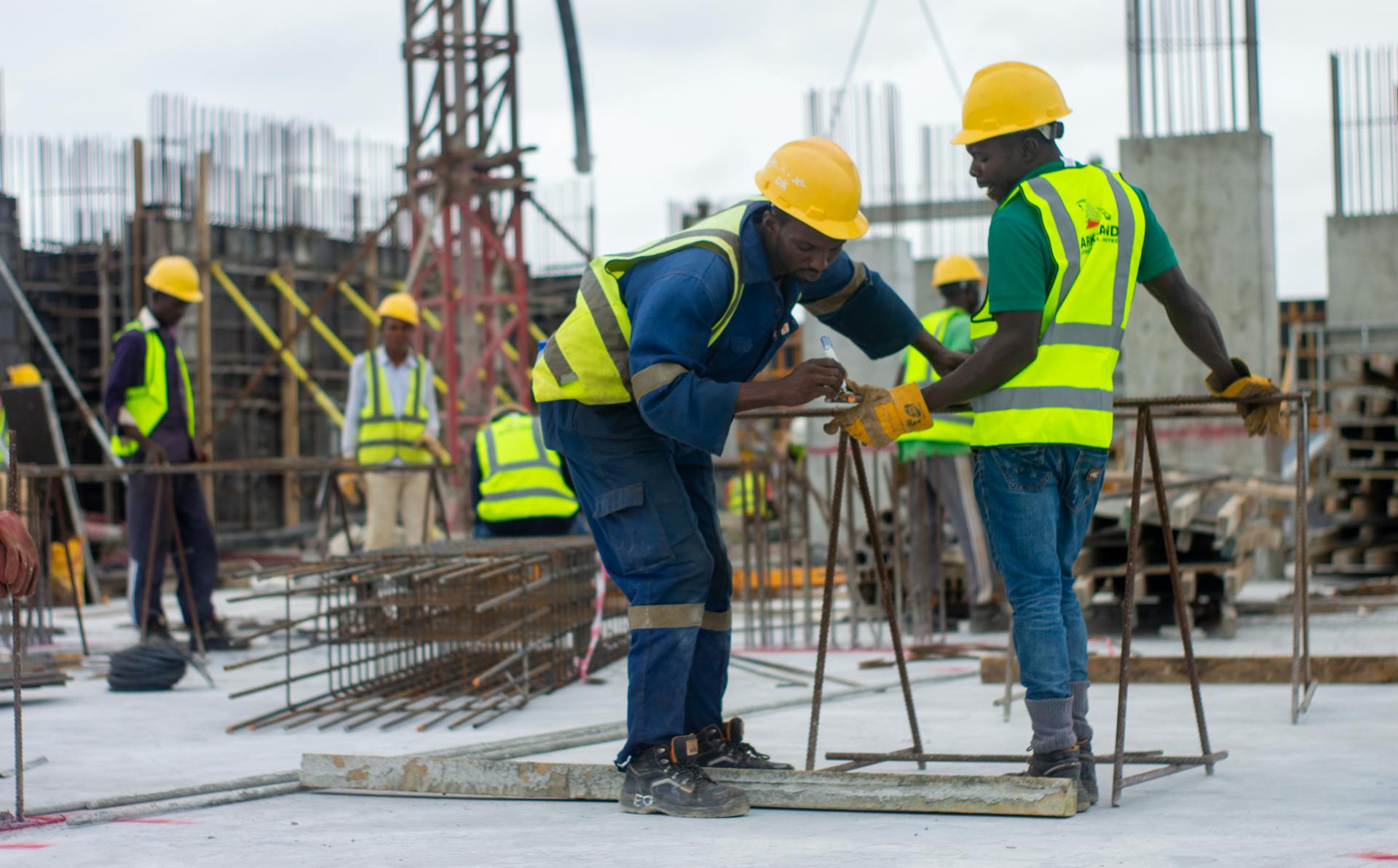Thai construction workers on a building site illustrating the migrant worker permit system