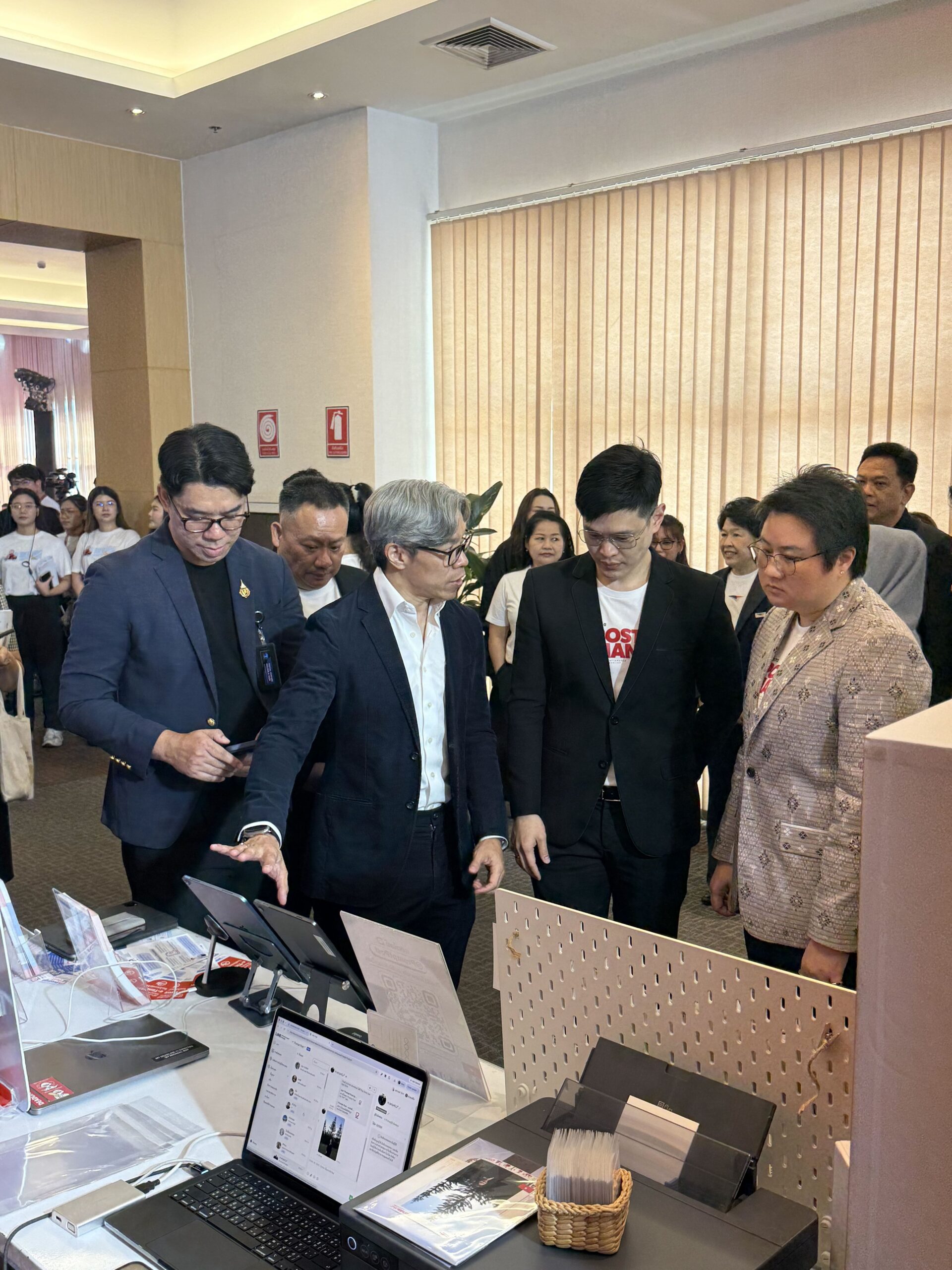 Transformational CEO Ariya Banomyong demonstrating Prompt Pass to Thailand Post leadership and the Deputy Minister of Digital Economy and Society at the 144th anniversary event in Bangkok.