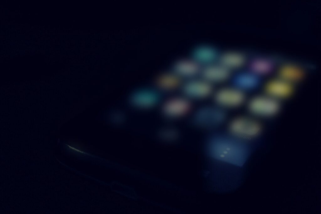 A phone showing a grid of apps, the point where Australia now requires app store age checks